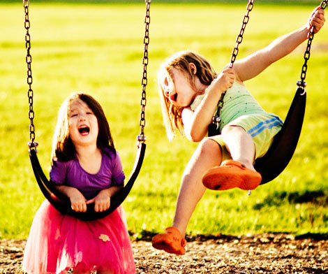 Children Paying On Swings In Oak Bay