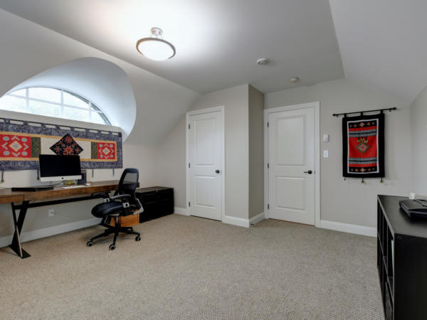 bedroom or office with vaulted ceiling